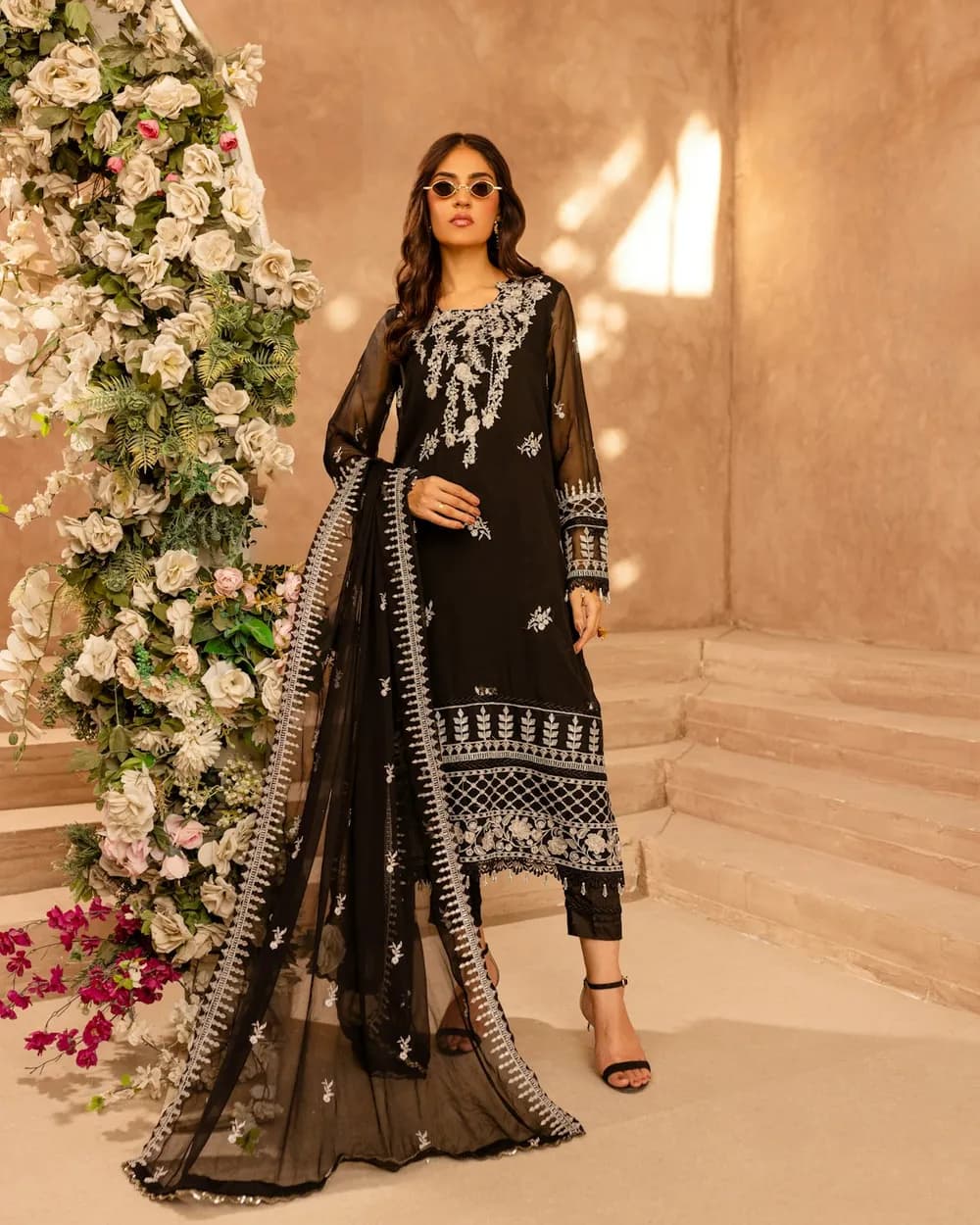 Embroidered black kameez with a sheer dupatta